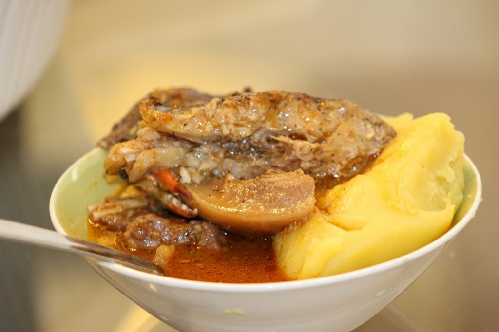 Trying the local cuisine in South Africa